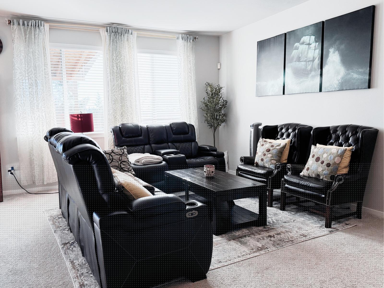 Living room with leather seating and natural light
