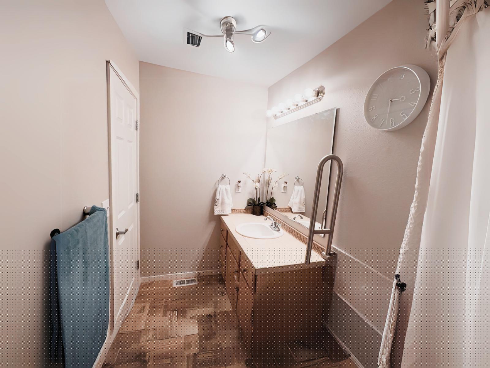 Bathroom with vanity and safety grab bar